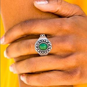 Silver ring with green stone